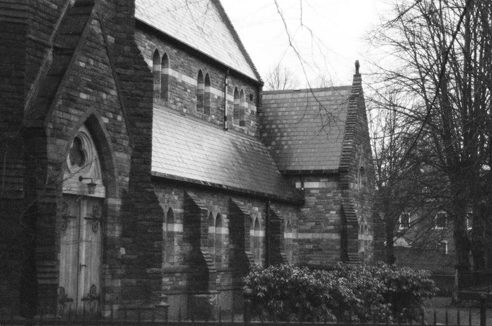 grayscale photo of brick building