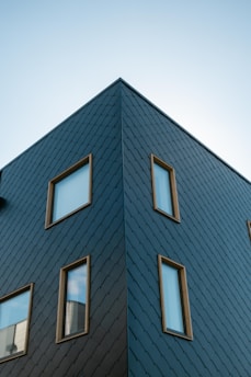 black concrete building with glass windows