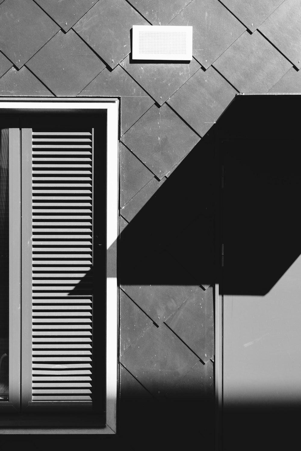 black and white photo of a window