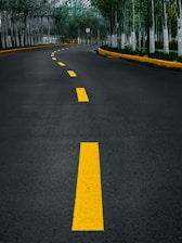 yellow line on gray asphalt road