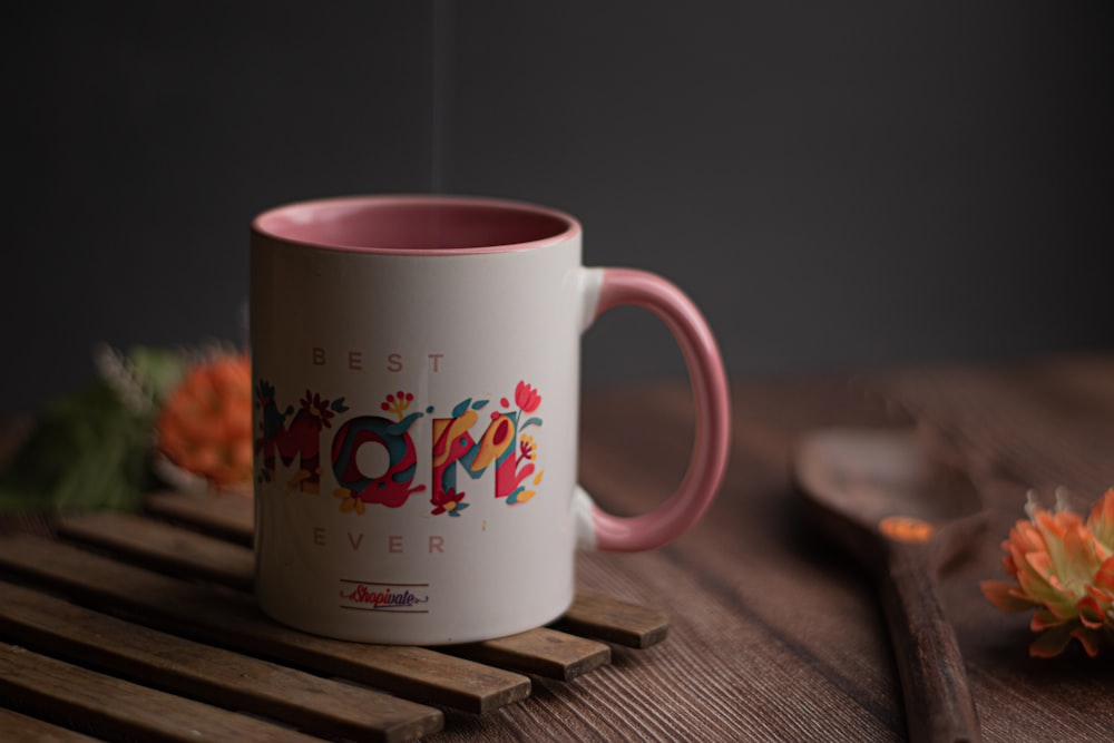 white ceramic mug on brown wooden table