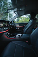 Luxury private SUV interior with leather seats and ambient lighting.