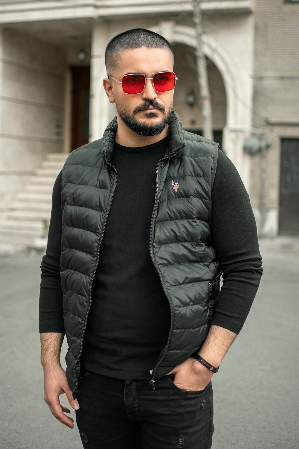 man in black leather jacket and black framed sunglasses