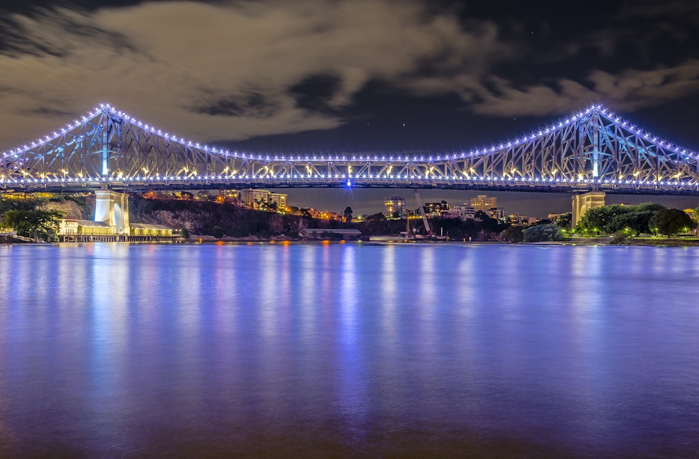 bridge over water during night time