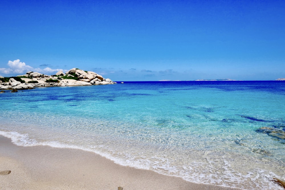 blue sea under blue sky during daytime