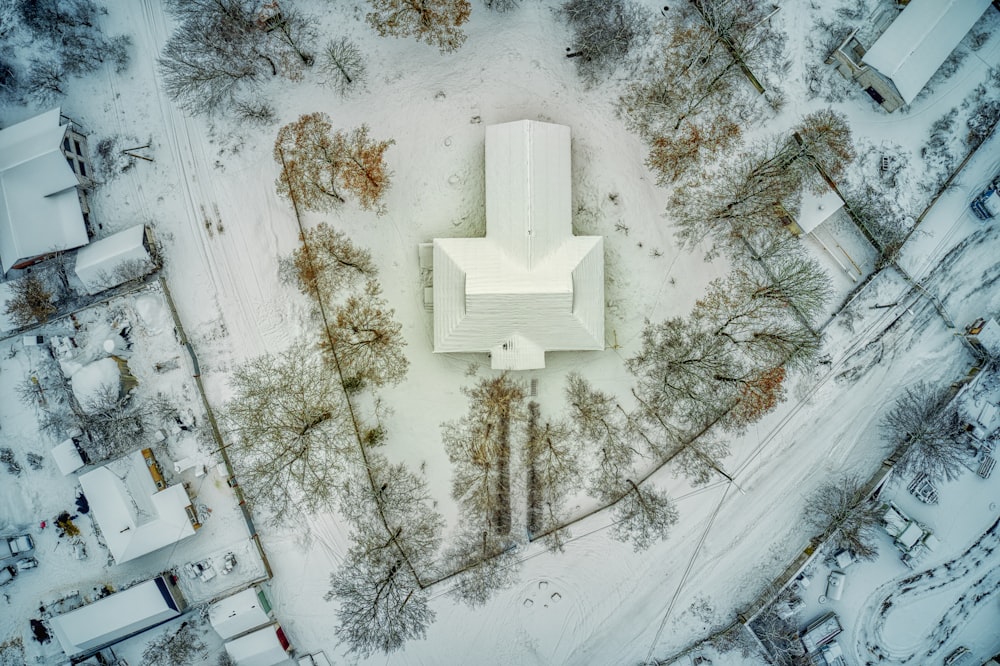 white concrete cross on snow covered ground