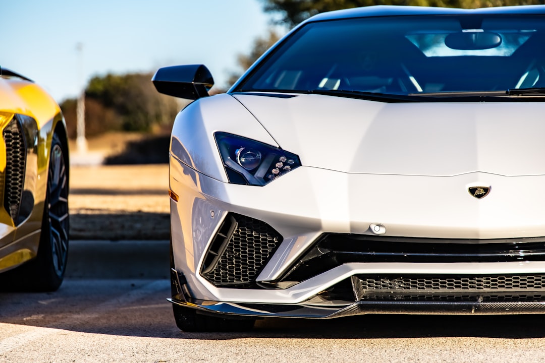 white lamborghini aventador on road during daytime