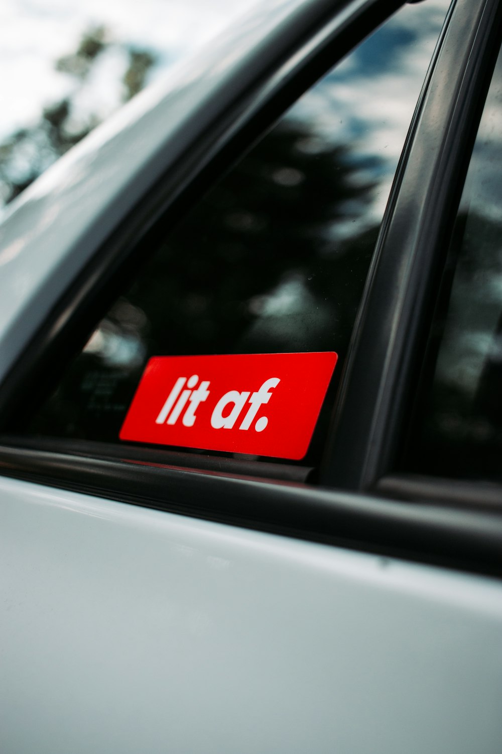 a red sticker that says it's off on the side of a car