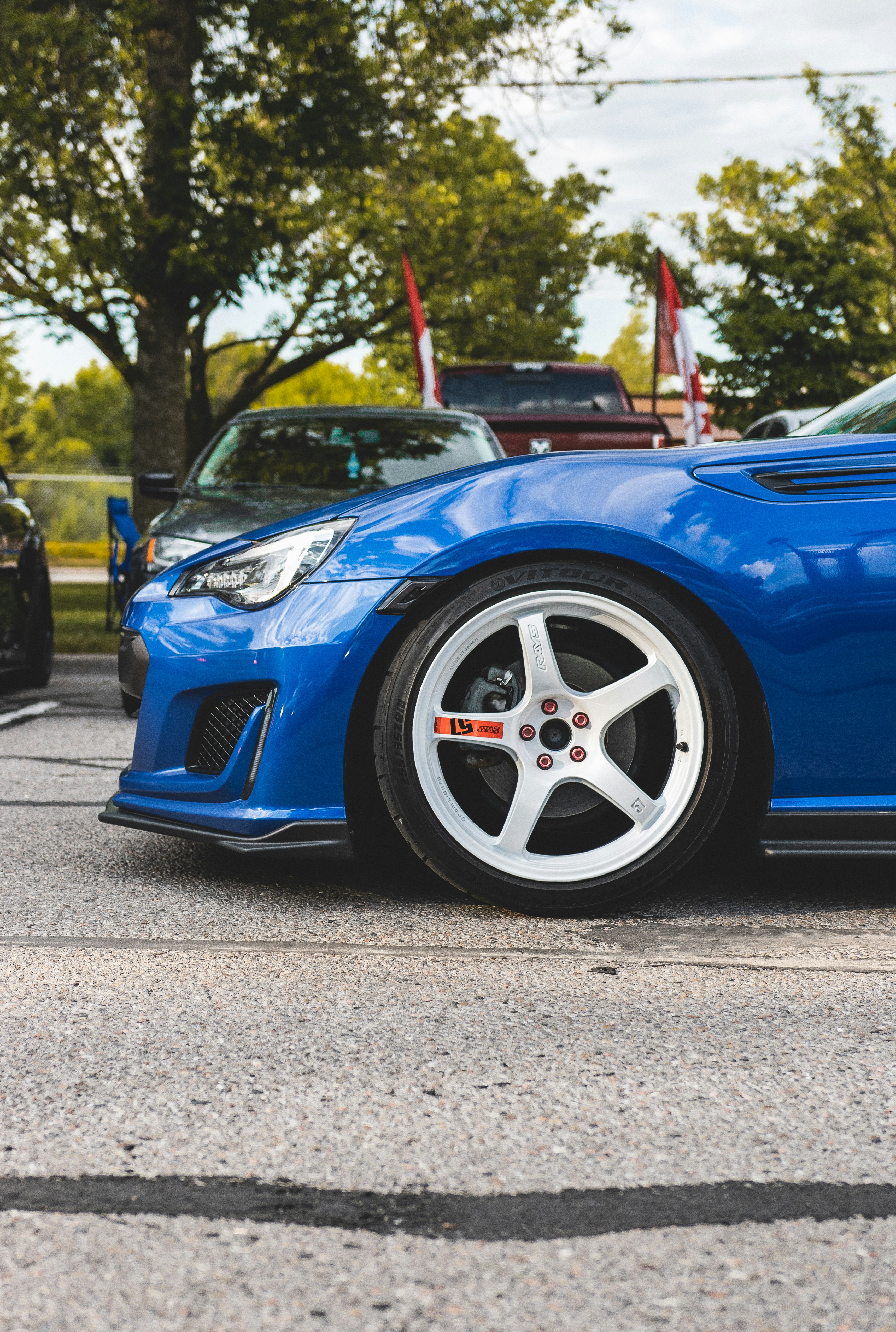 blue car on gray asphalt road during daytime