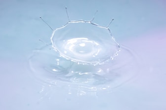 water drop in clear glass bowl