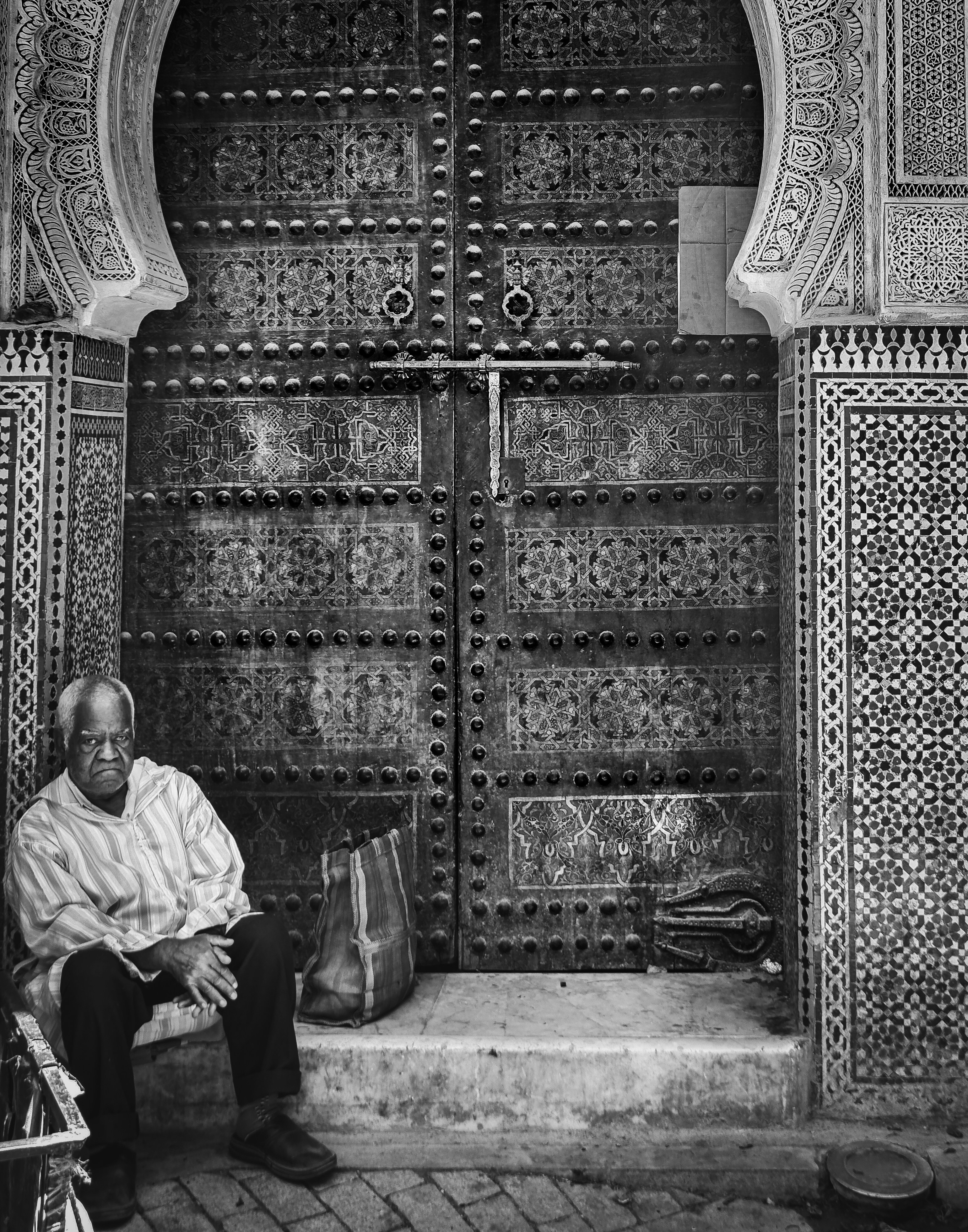 man in white shirt sitting on chair
