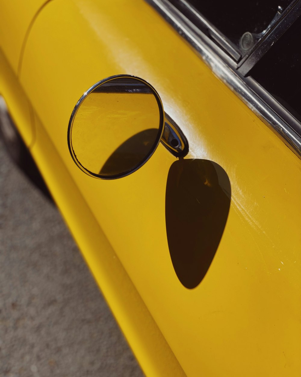 black sunglasses on yellow car