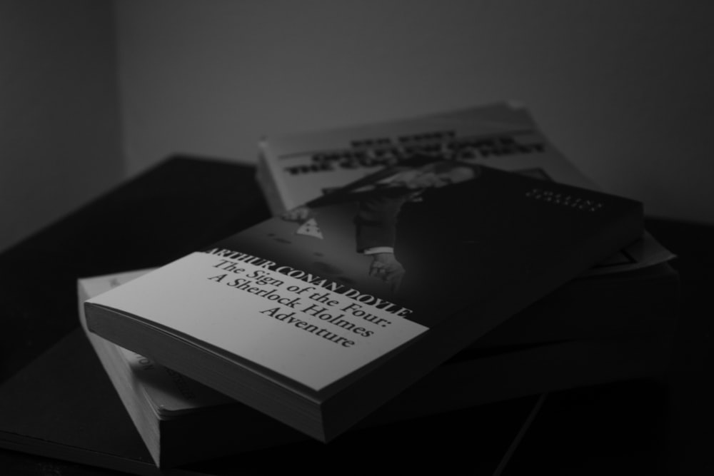 grayscale photo of a book