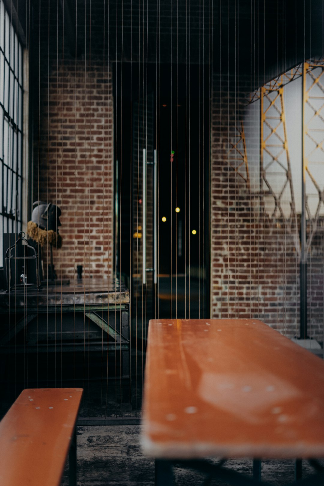 black metal gate near brown wooden table