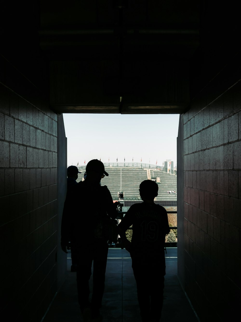 people standing near glass window during daytime