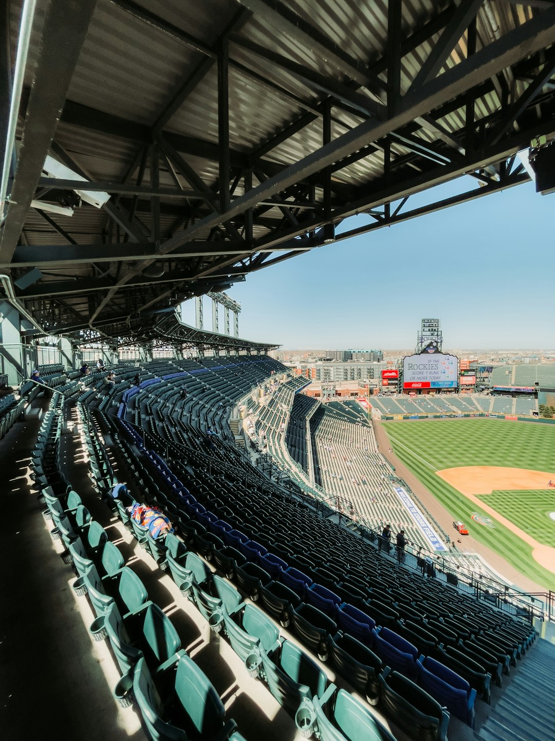 people sitting on stadium seats during daytime