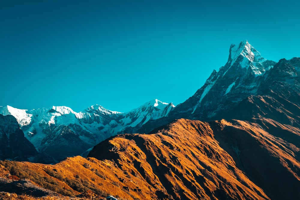 brown and white mountains under blue sky during daytime