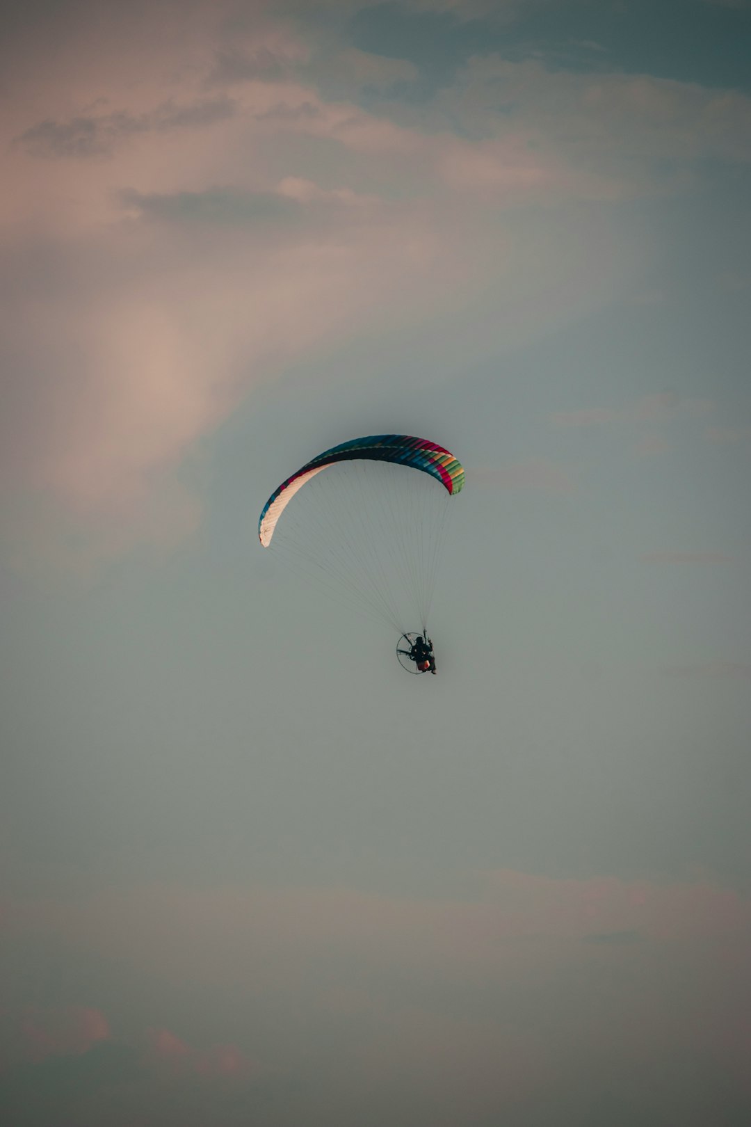 person in parachute in mid air