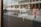 A blurred reflection of an urban street scene visible through a glass window with the words 'Print Matters!' printed in white, showcasing a focus on typography.