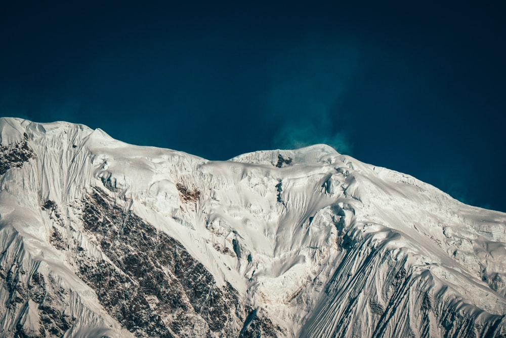 snow covered mountain under blue sky during daytime