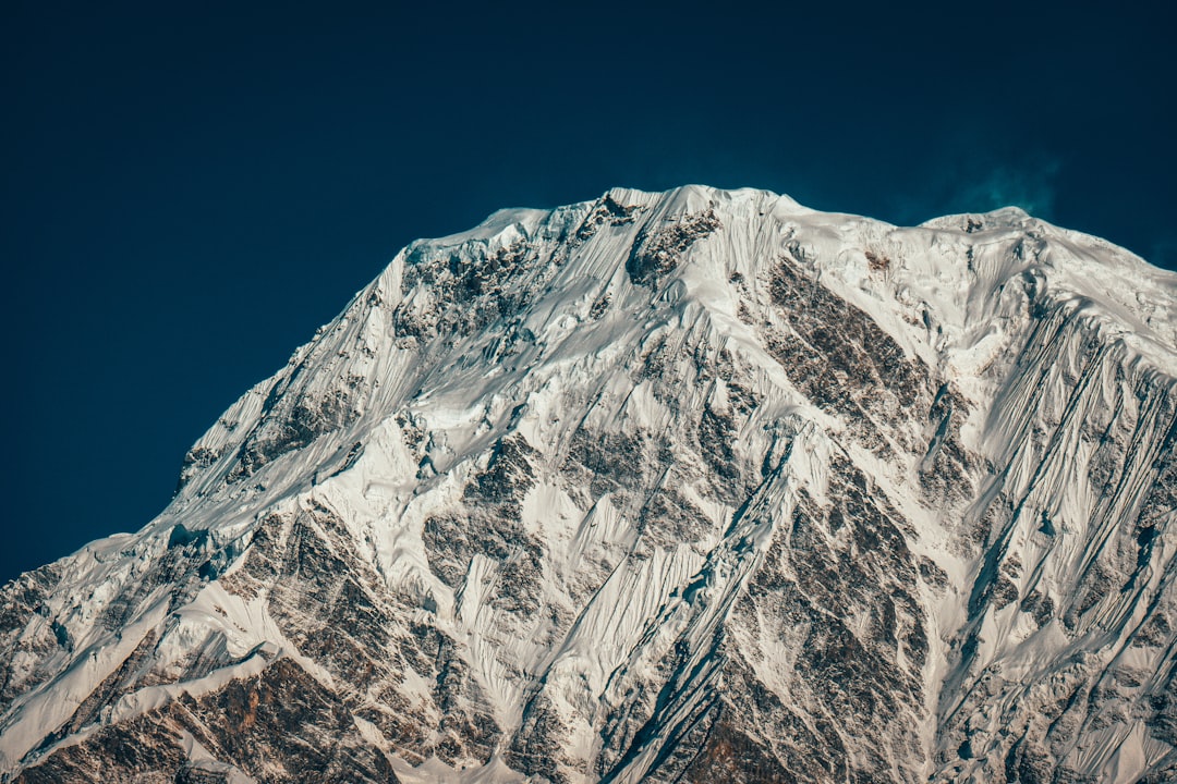 gray and white mountain under blue sky during daytime