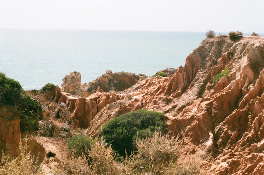 a view of the ocean from a rocky cliff