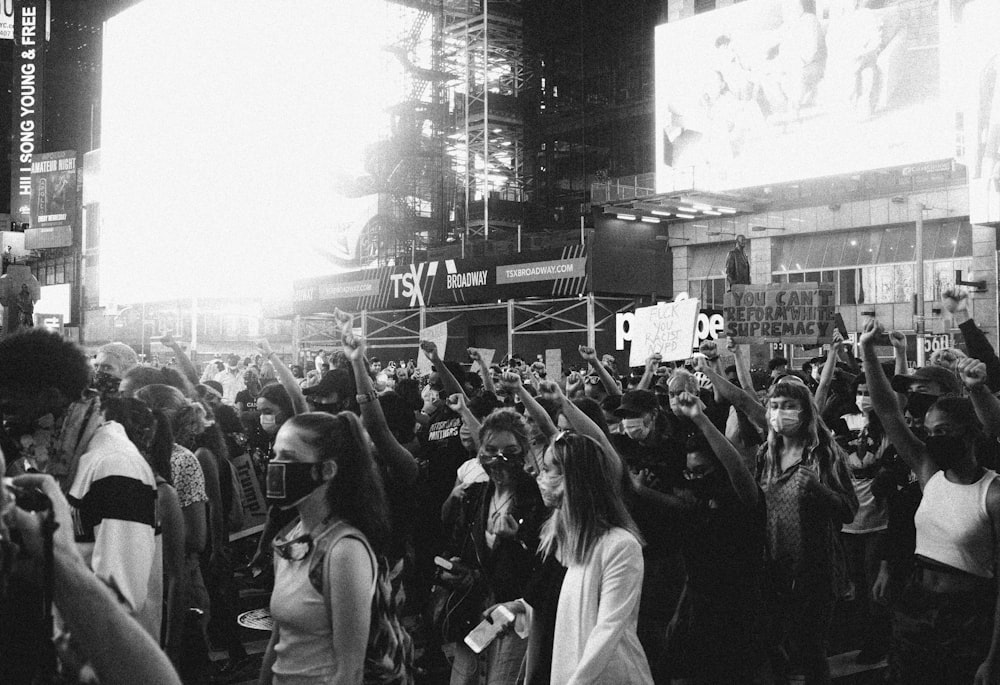 grayscale photo of people in a concert