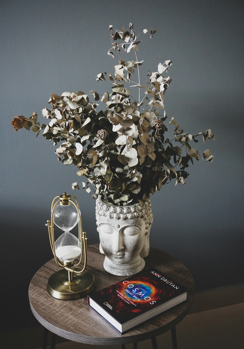 white and brown flower in clear glass vase