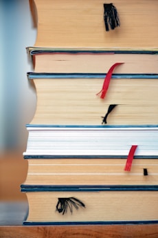 red umbrella on brown wooden book