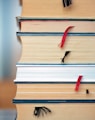 red umbrella on brown wooden book