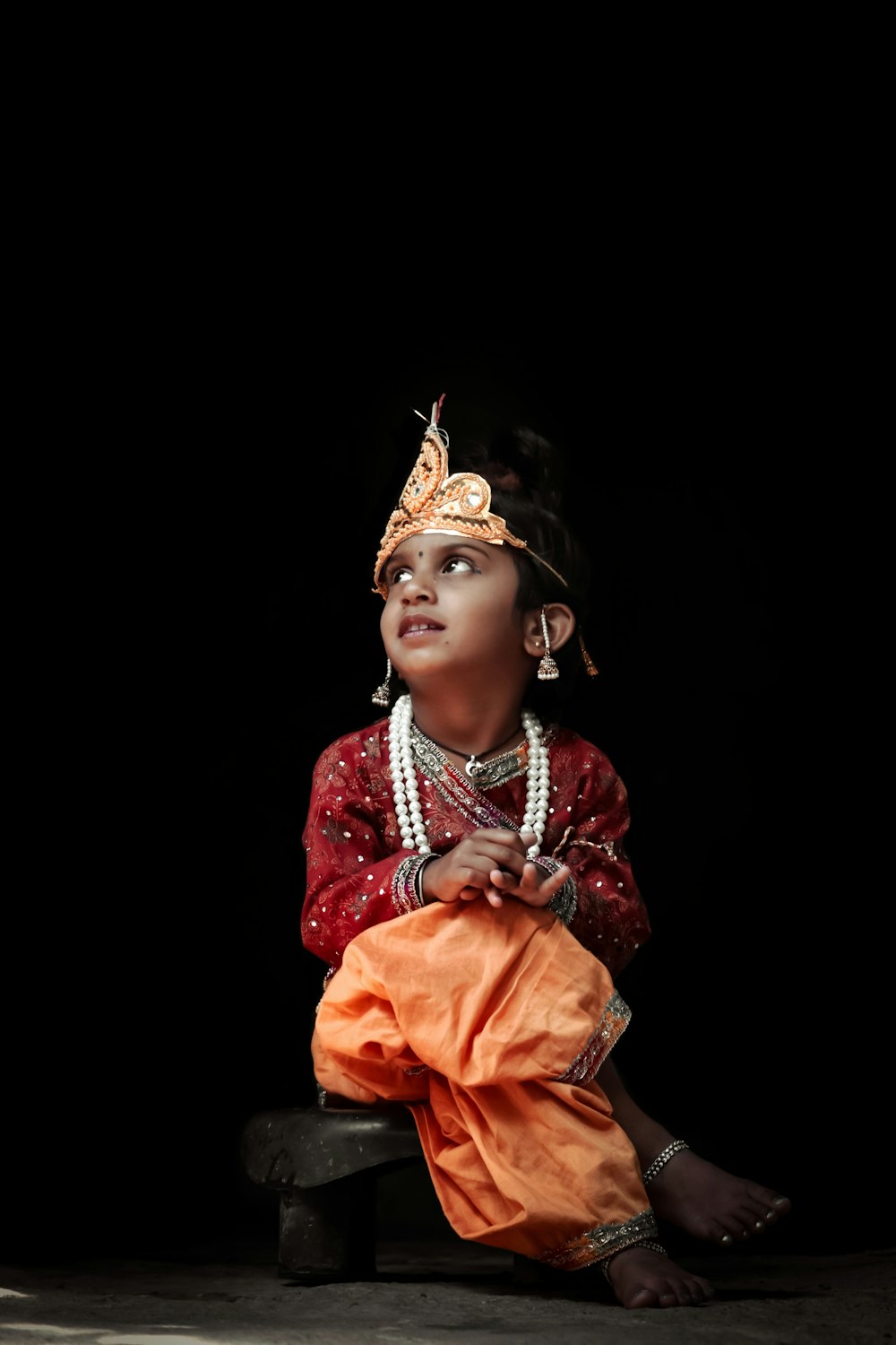 woman in red and gold traditional dress