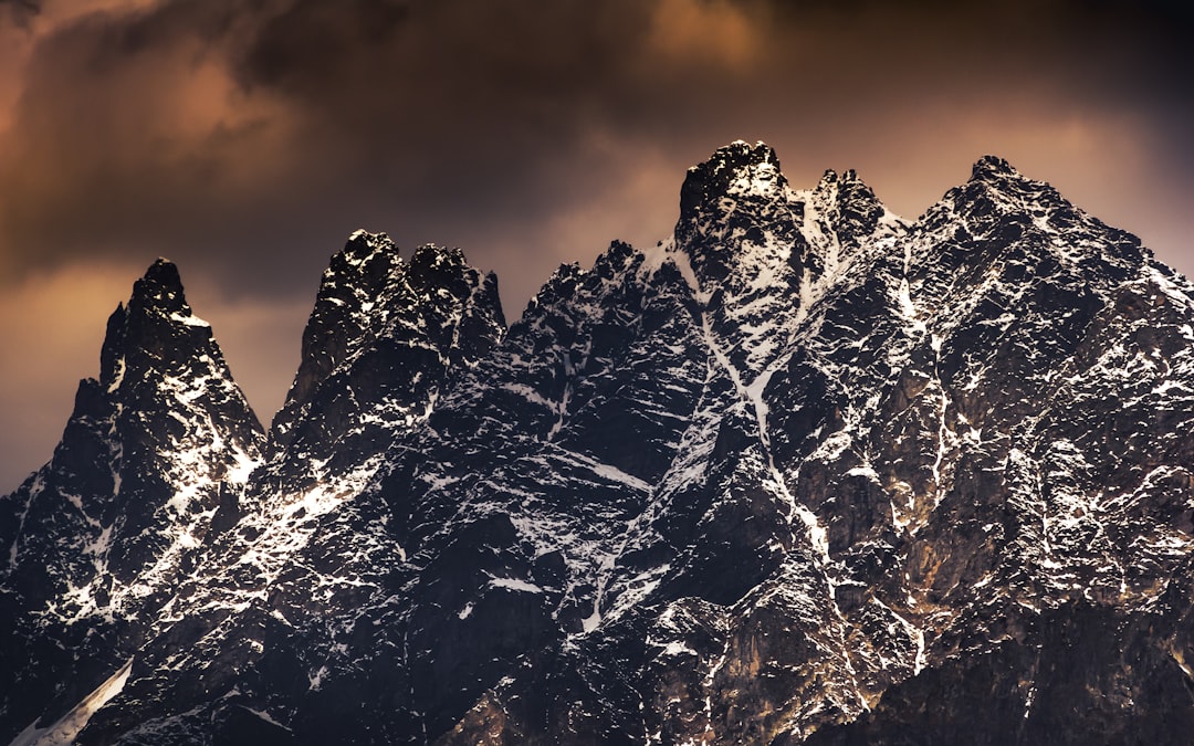 snow covered mountain during daytime