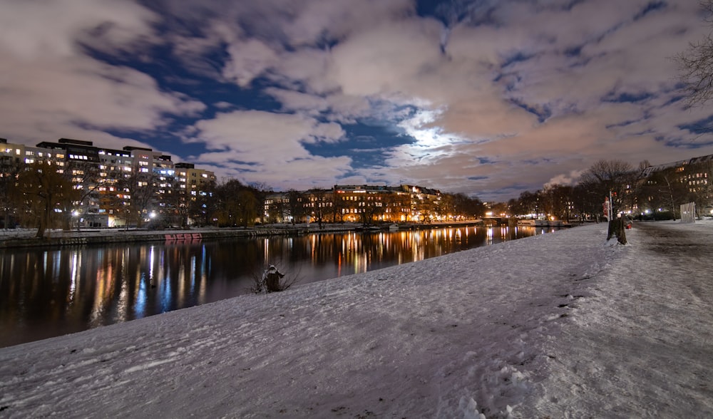 body of water near city during night time