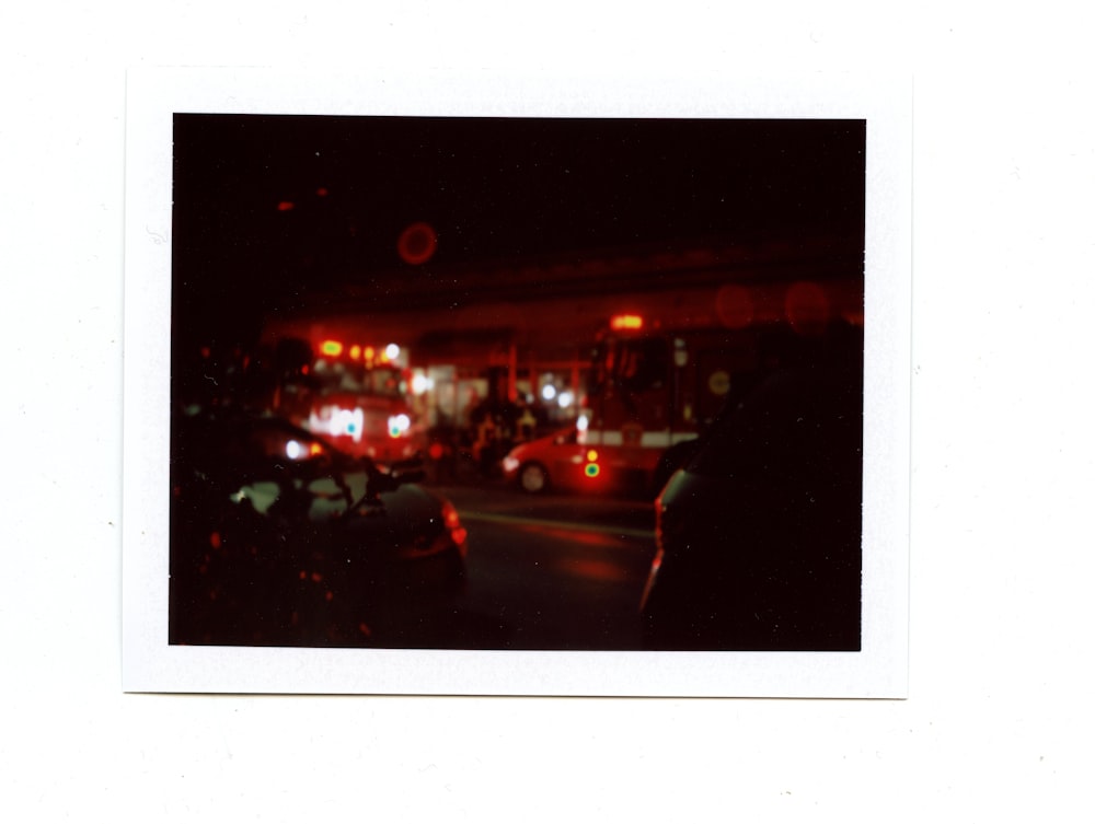 cars parked on side of the road during night time