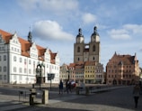 A historic European city square filled with charming architecture and outdoor cafes.
