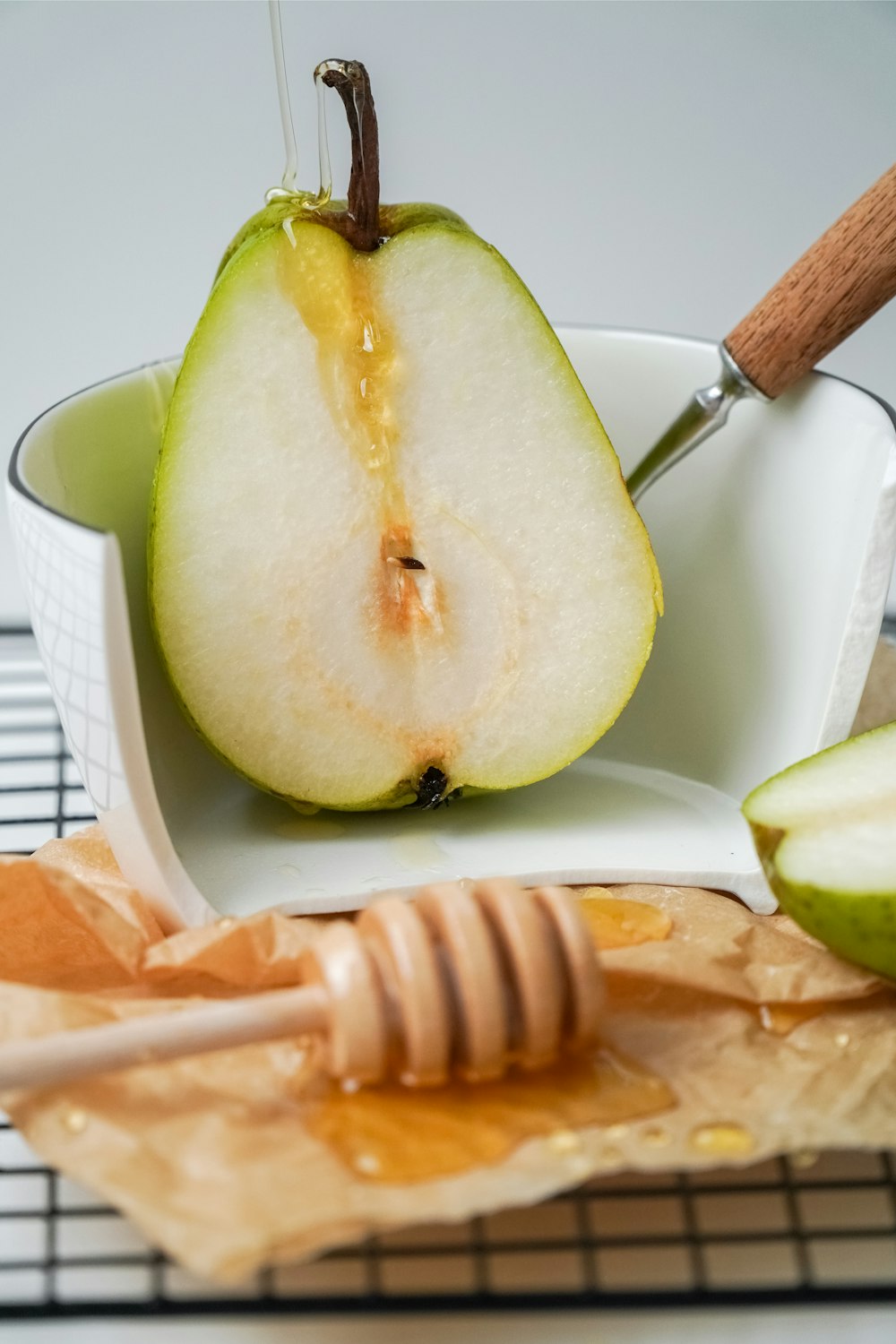 sliced green fruit on white ceramic plate