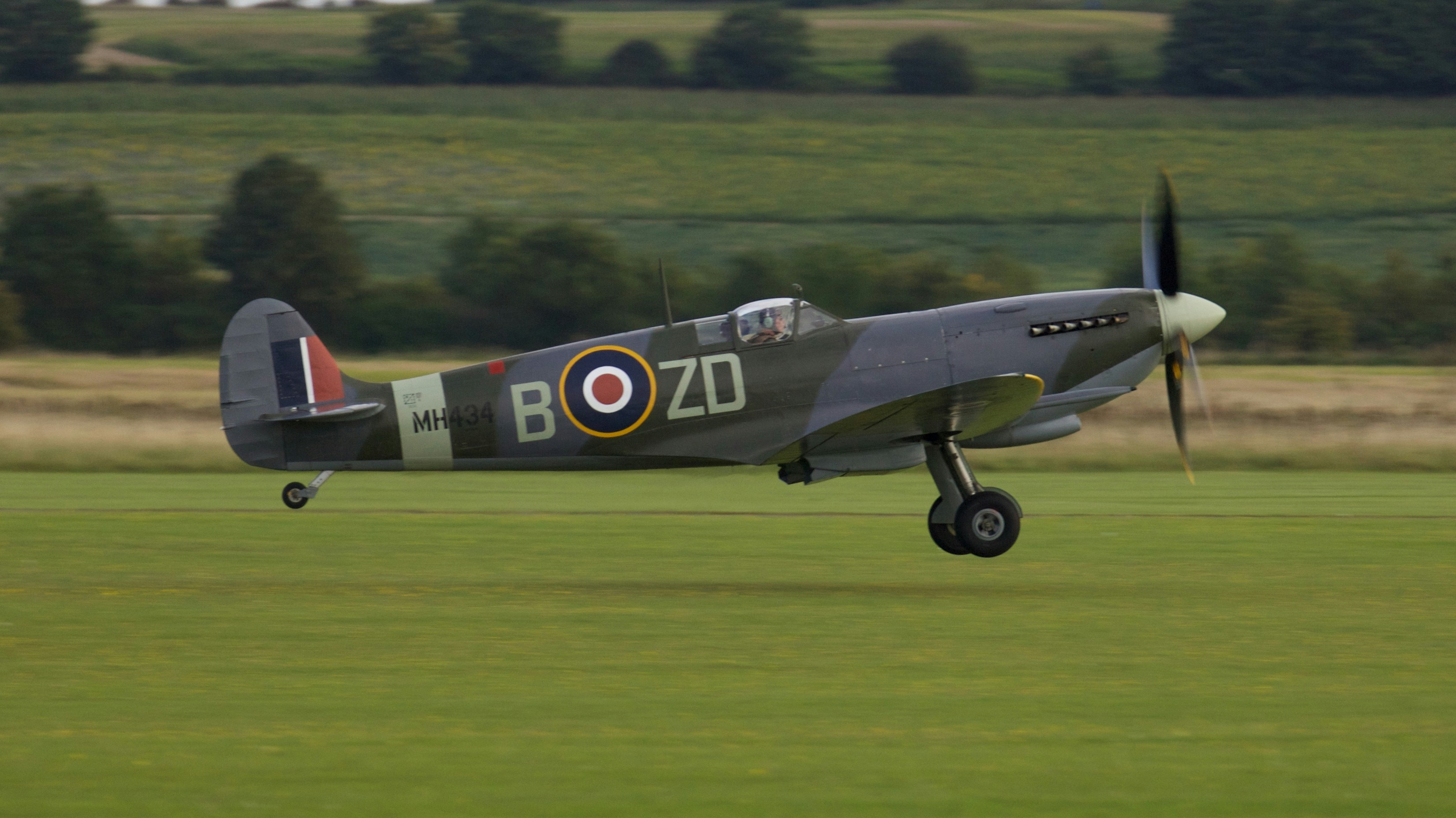 gray and red jet plane on green grass field during daytime, Spitfire