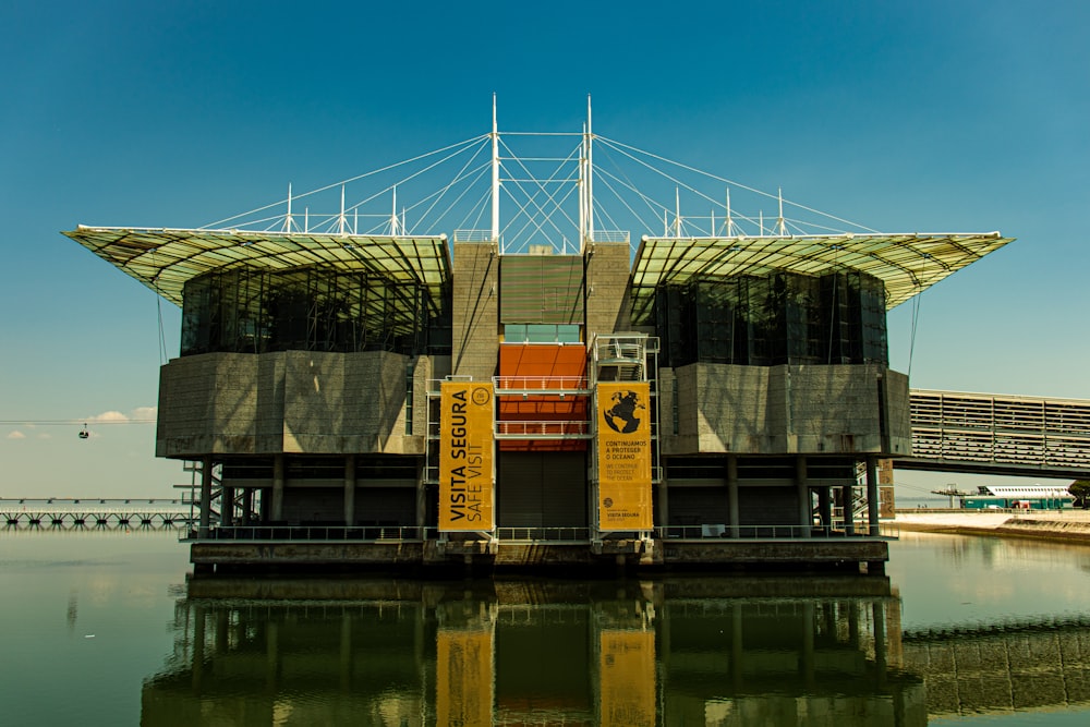 brown and white concrete building near body of water during daytime