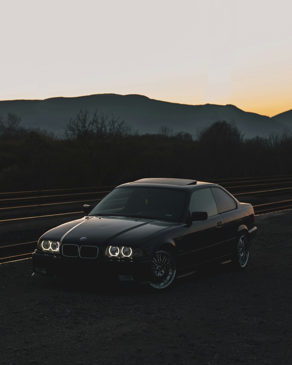 black mercedes benz coupe on road during daytime