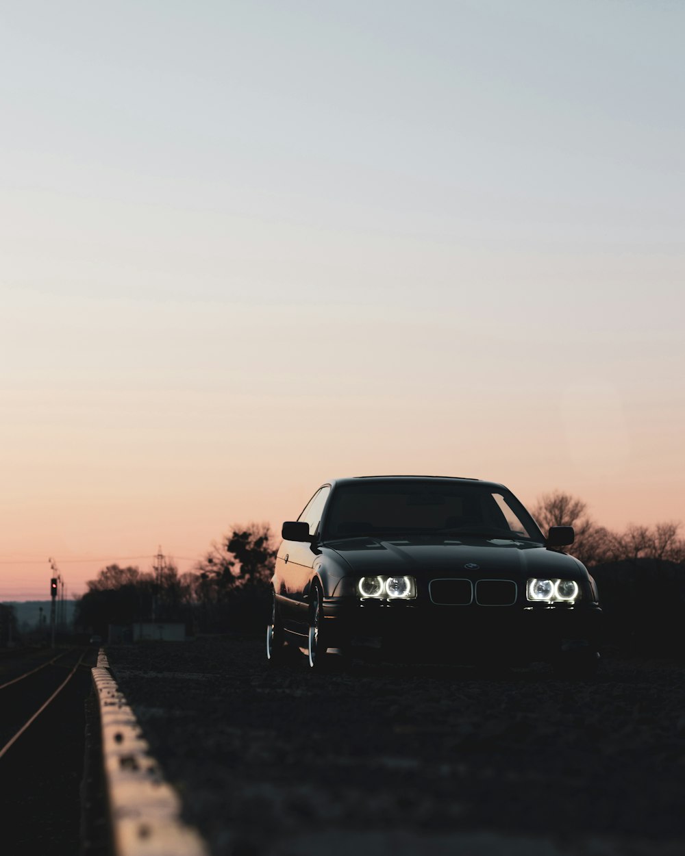 black mercedes benz car on road during sunset