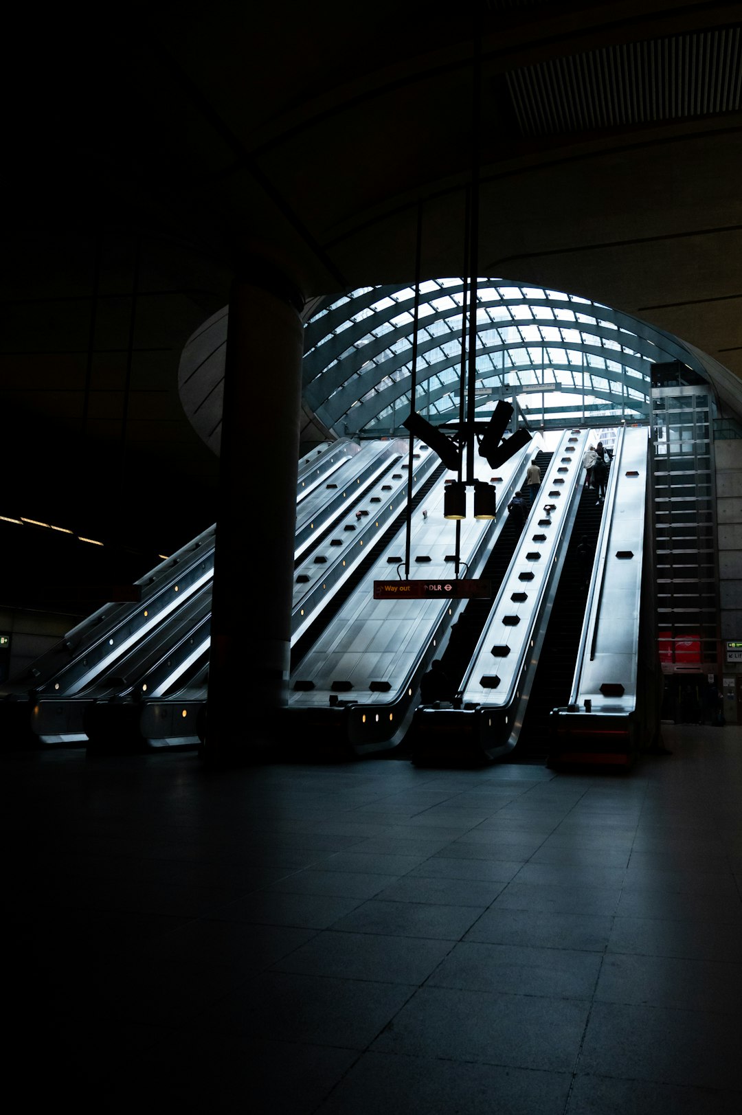 black and white escalator in a building