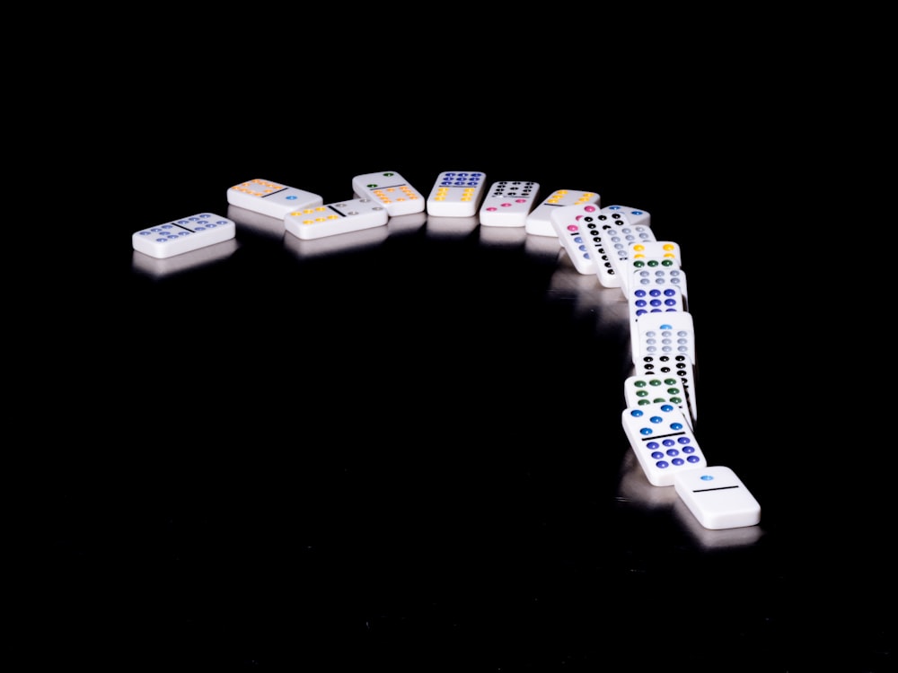 silver and white bracelet on white surface