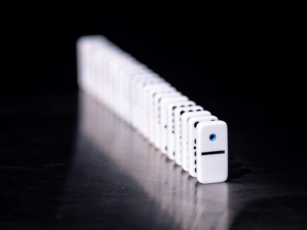 white iphone 4s on brown wooden table