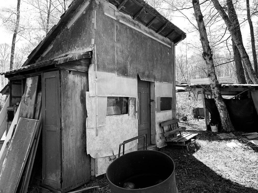 grayscale photo of wooden house