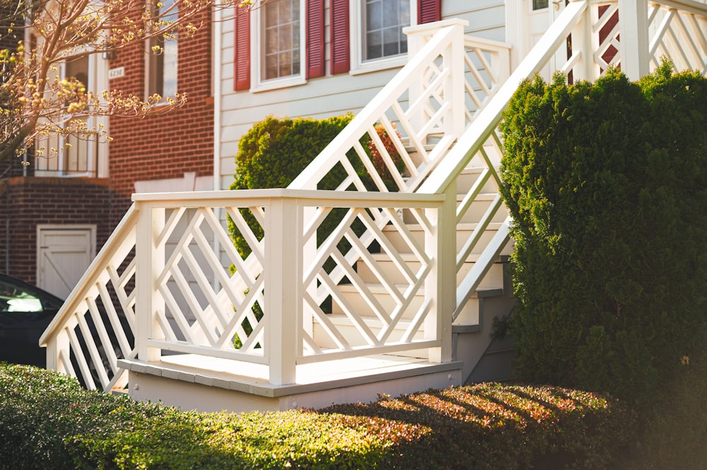 white wooden staircase near green grass