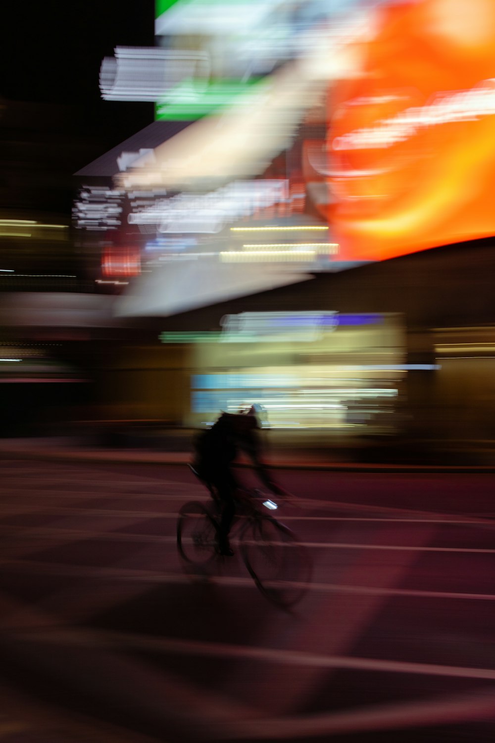 man in black jacket riding bicycle on road during daytime