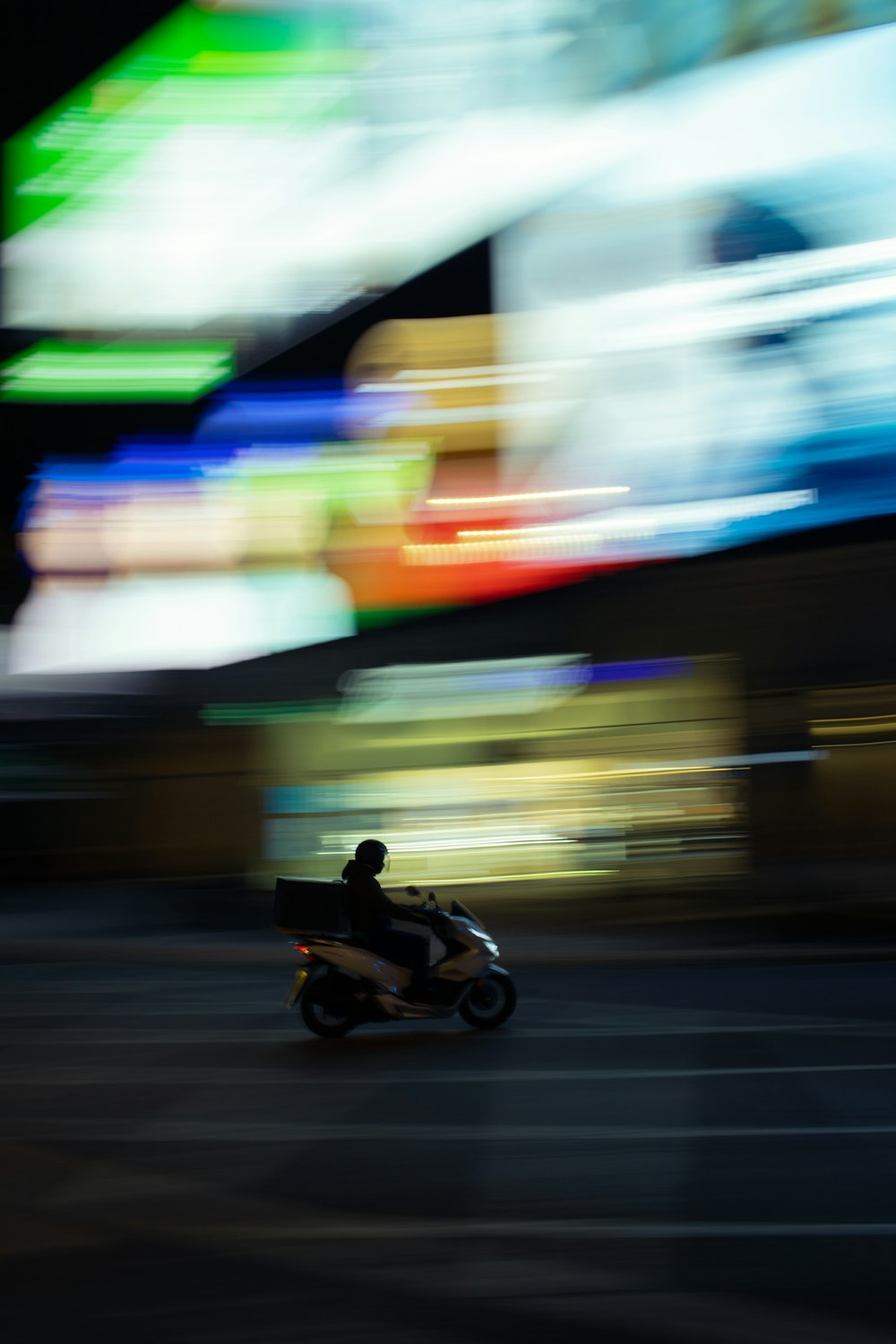 man riding motorcycle on road
