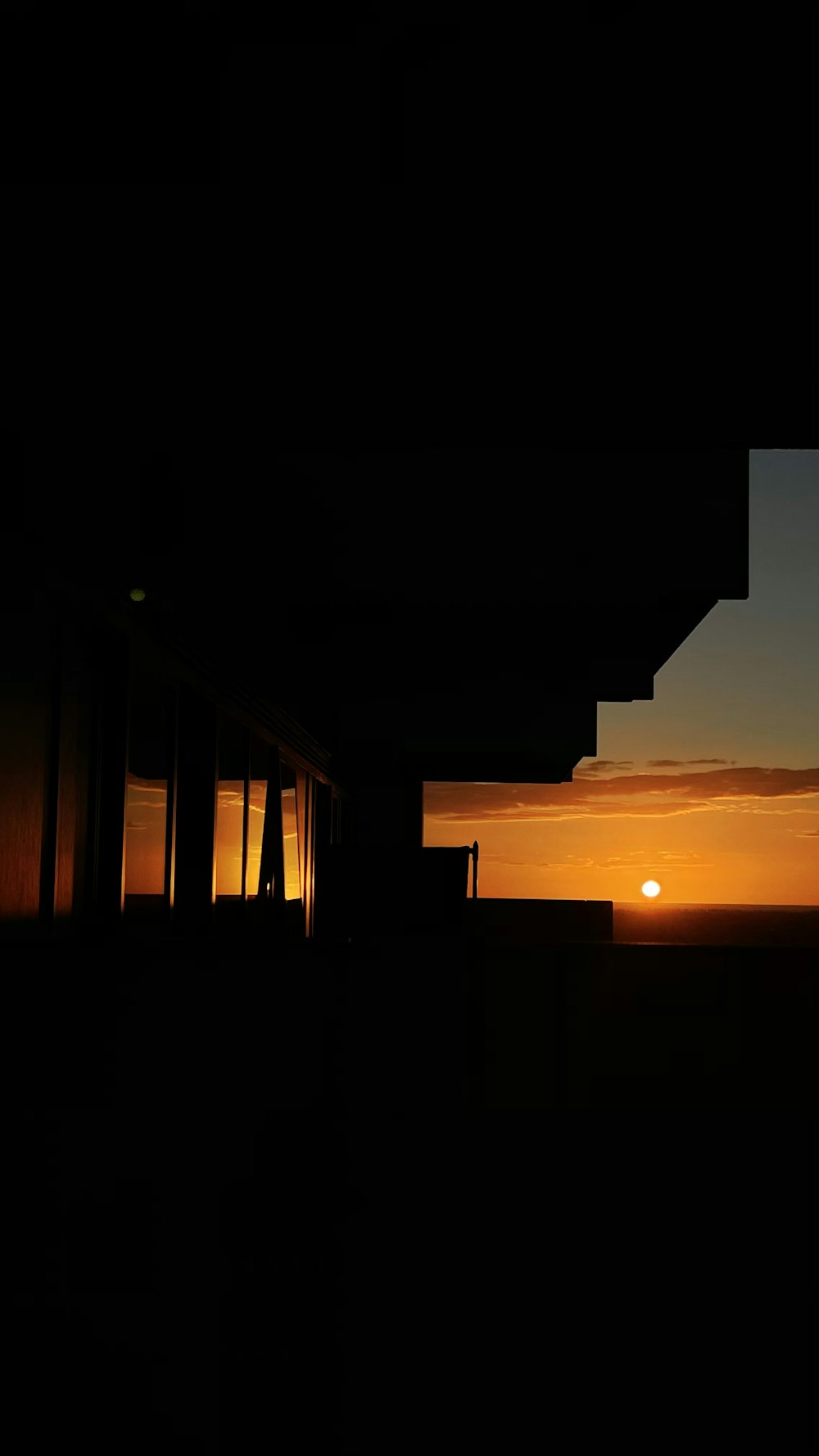 silhouette of building during sunset