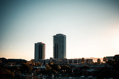 A cityscape of Málaga with elegant office buildings at sunset.