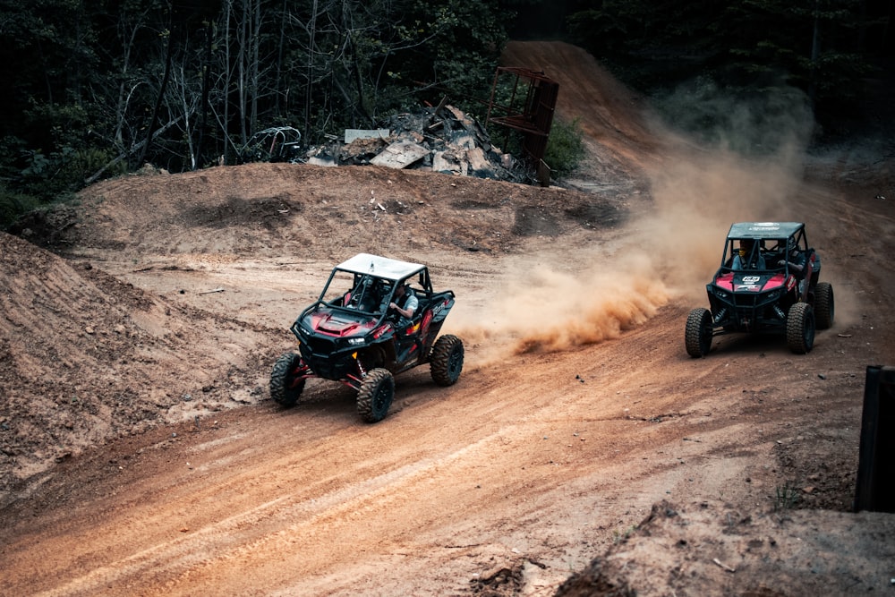 black and red atv on brown dirt road during daytime